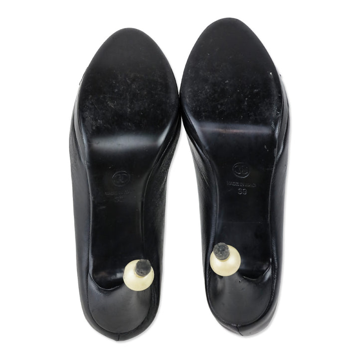 Chanel Black Leather Camellia Flower Appliqué Pearl Caviar Platform Pump
