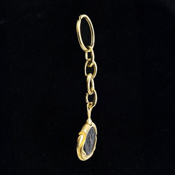 Donna Karan Black Intaglio Cherub Gold Tone Key Chain
