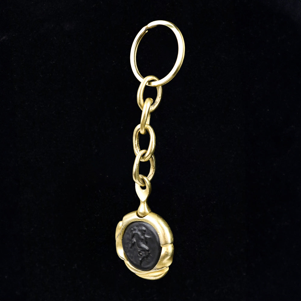 Donna Karan Black Intaglio Cherub Gold Tone Key Chain