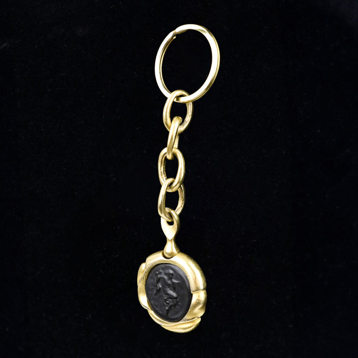 Donna Karan Black Intaglio Cherub Gold Tone Key Chain