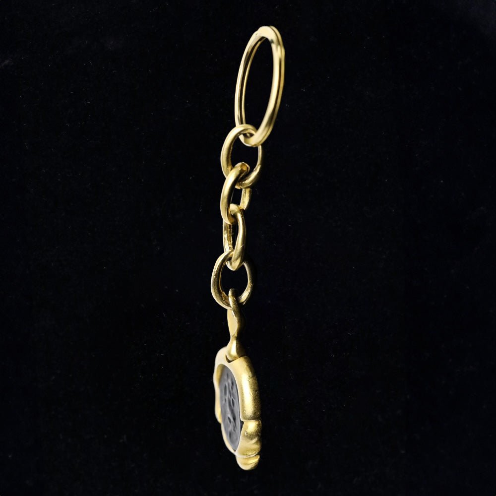 Donna Karan Black Intaglio Cherub Gold Tone Key Chain