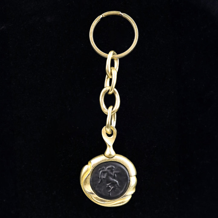 Donna Karan Black Intaglio Cherub Gold Tone Key Chain