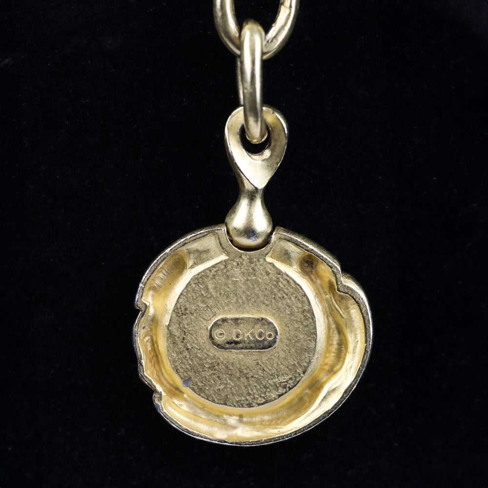 Donna Karan Black Intaglio Cherub Gold Tone Key Chain