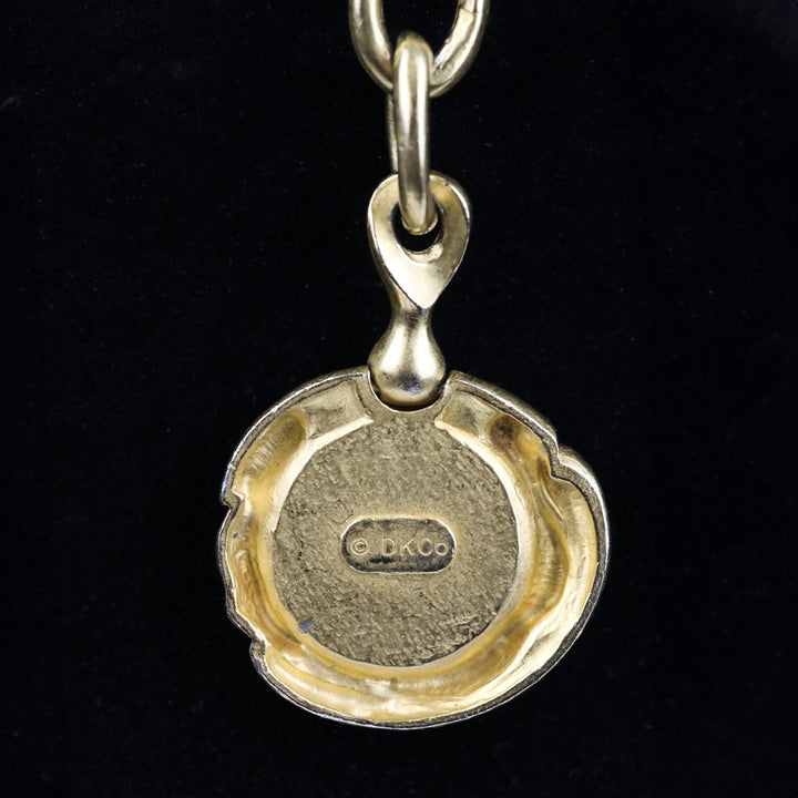 Donna Karan Black Intaglio Cherub Gold Tone Key Chain