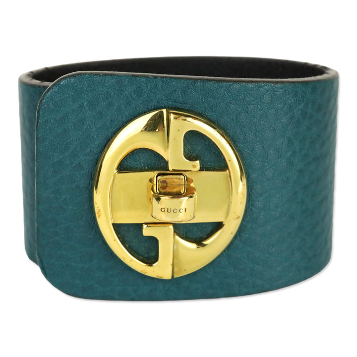 Gucci Gold Tone Turnkey GG Teal Embossed Leather Bracelet