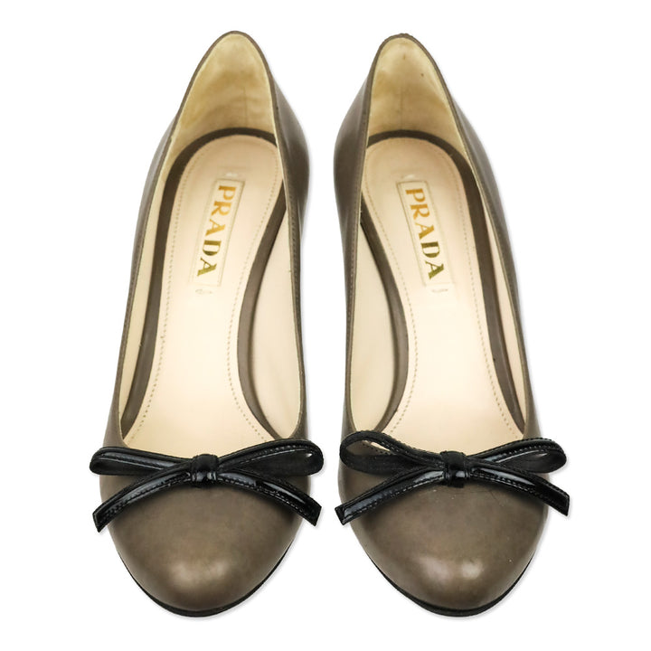 Prada Taupe Leather Black Patent Leather Bow Pumps