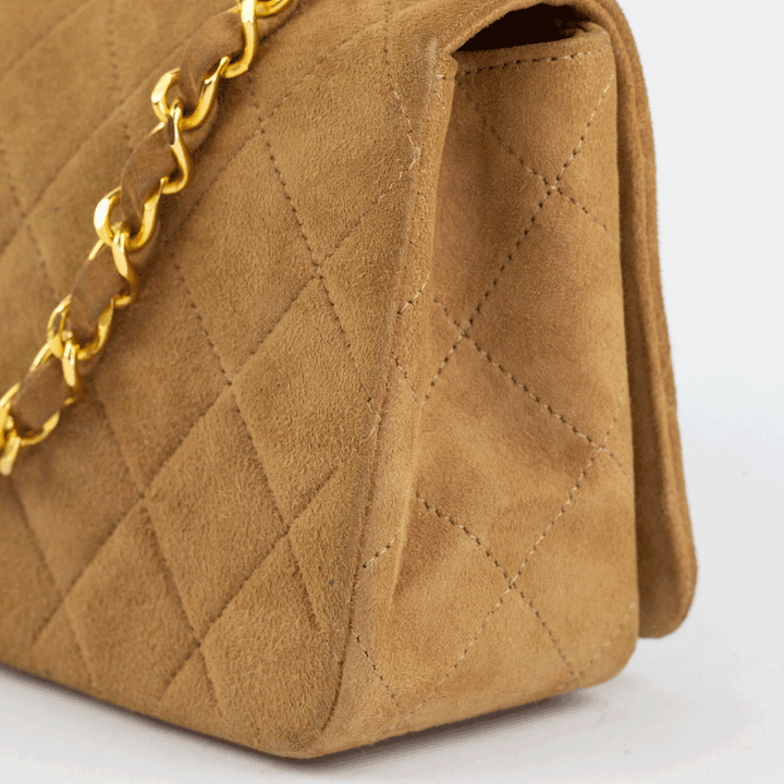 corner view of Chanel Vintage Tan Suede Mini Flap Crossbody Bag