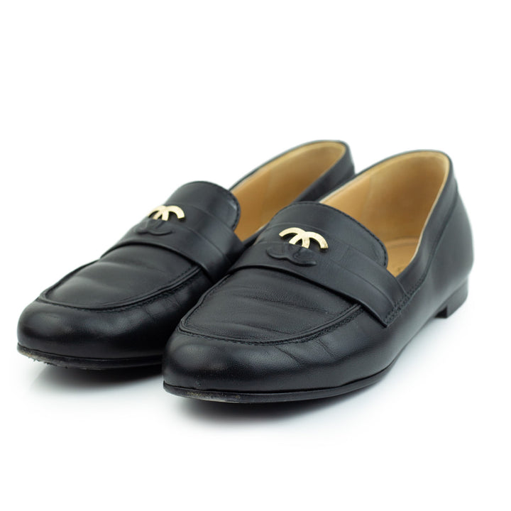 side view of Chanel Black Leather Interlocking CC Loafers