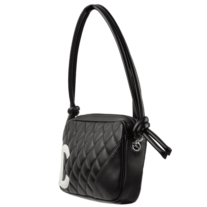 side view of Chanel Ligne Cambon Black and White Pochette Bag
