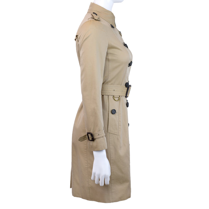 side view of Burberry The Sandringham Tan Trench Coat