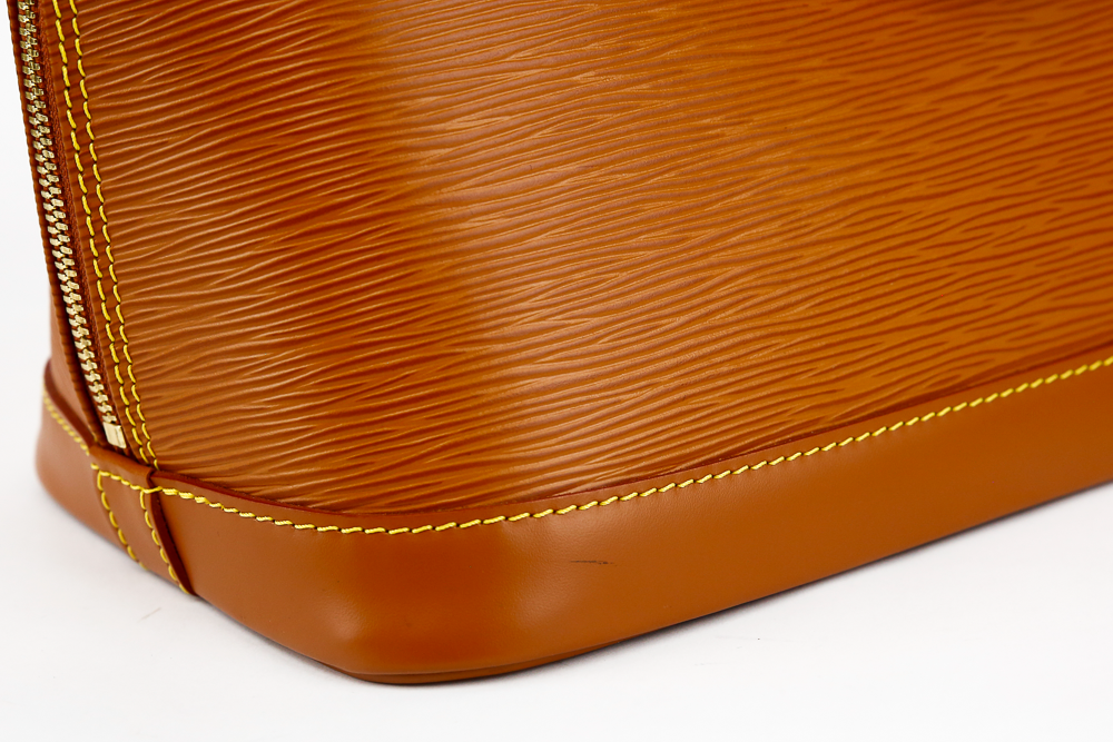 corner view of Louis Vuitton Tan Epi Leather Alma PM Tote