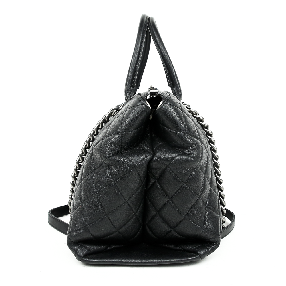 side view of Chanel Boy Chained Medium Black Quilted Tote Bag
