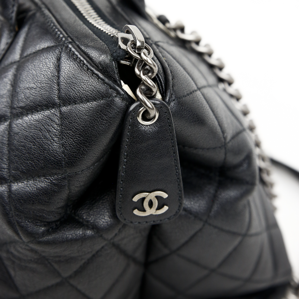 zipper pull view of Chanel Boy Chained Medium Black Quilted Tote Bag
