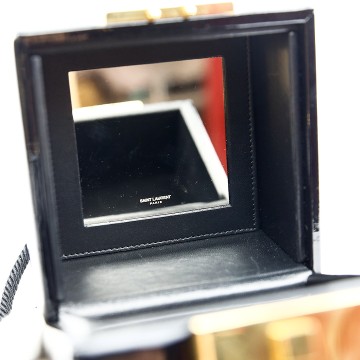 interior mirror view of Saint Laurent Black Patent Jerry Cube Box Clutch