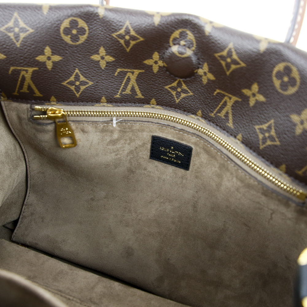 interior zip view of Louis Vuitton Monogram Canvas & Black Leather W PM Bag