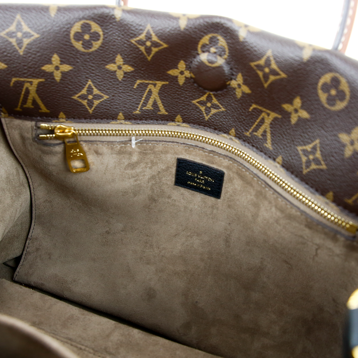 interior zip view of Louis Vuitton Monogram Canvas & Black Leather W PM Bag