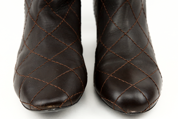 front view of Chanel Brown Leather Quilted Knee High Boots