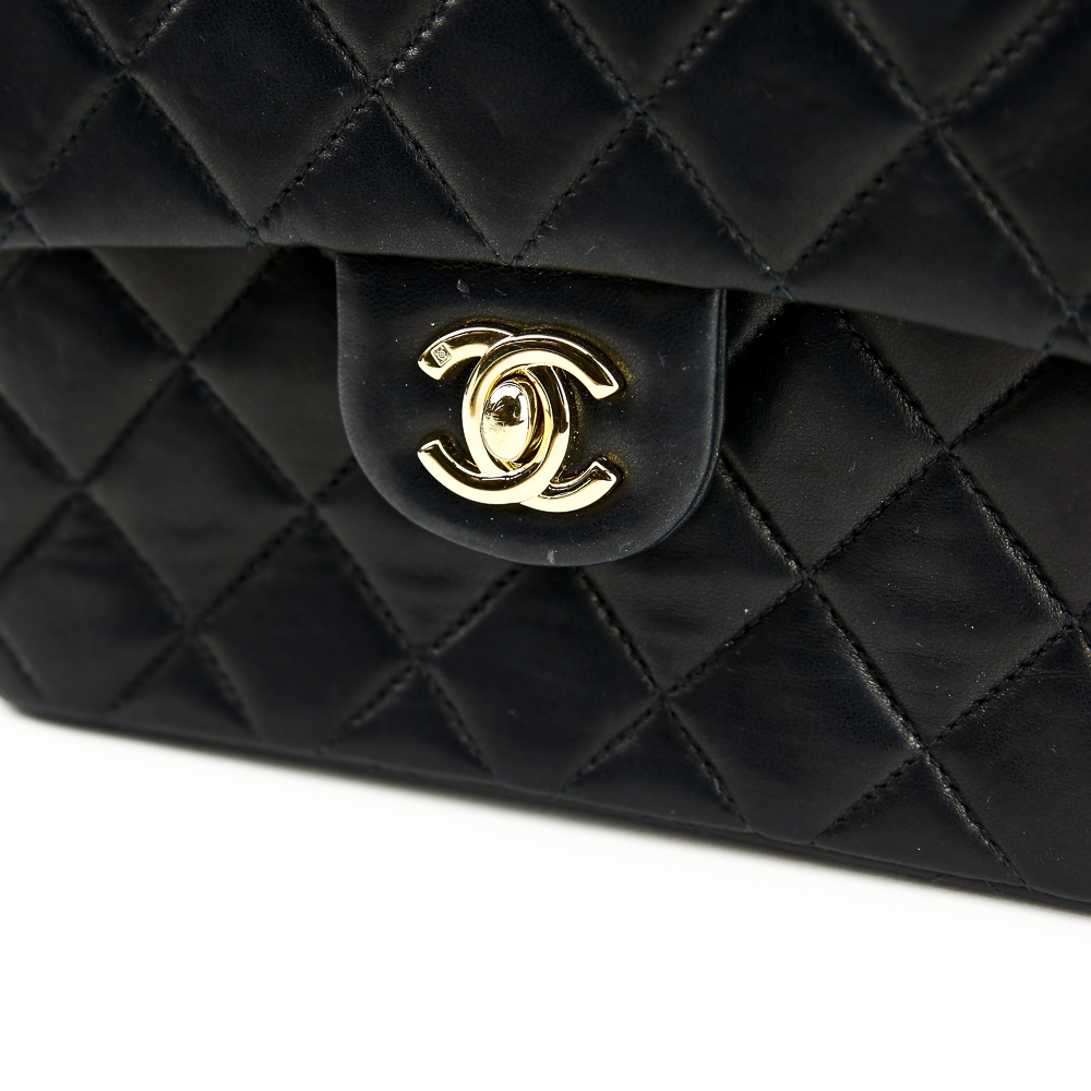 Turnlock view of Chanel Black Lambskin Classic Square Mini Flap Bag (2000)