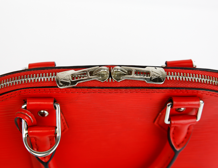 zip view of Louis Vuitton Red Epi Leather Alma BB