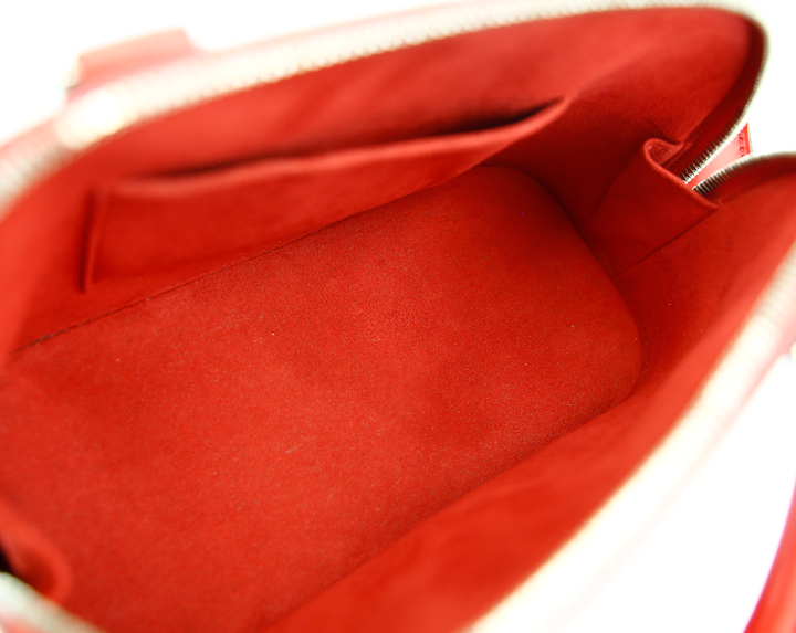 interior view of Louis Vuitton Red Epi Leather Alma BB
