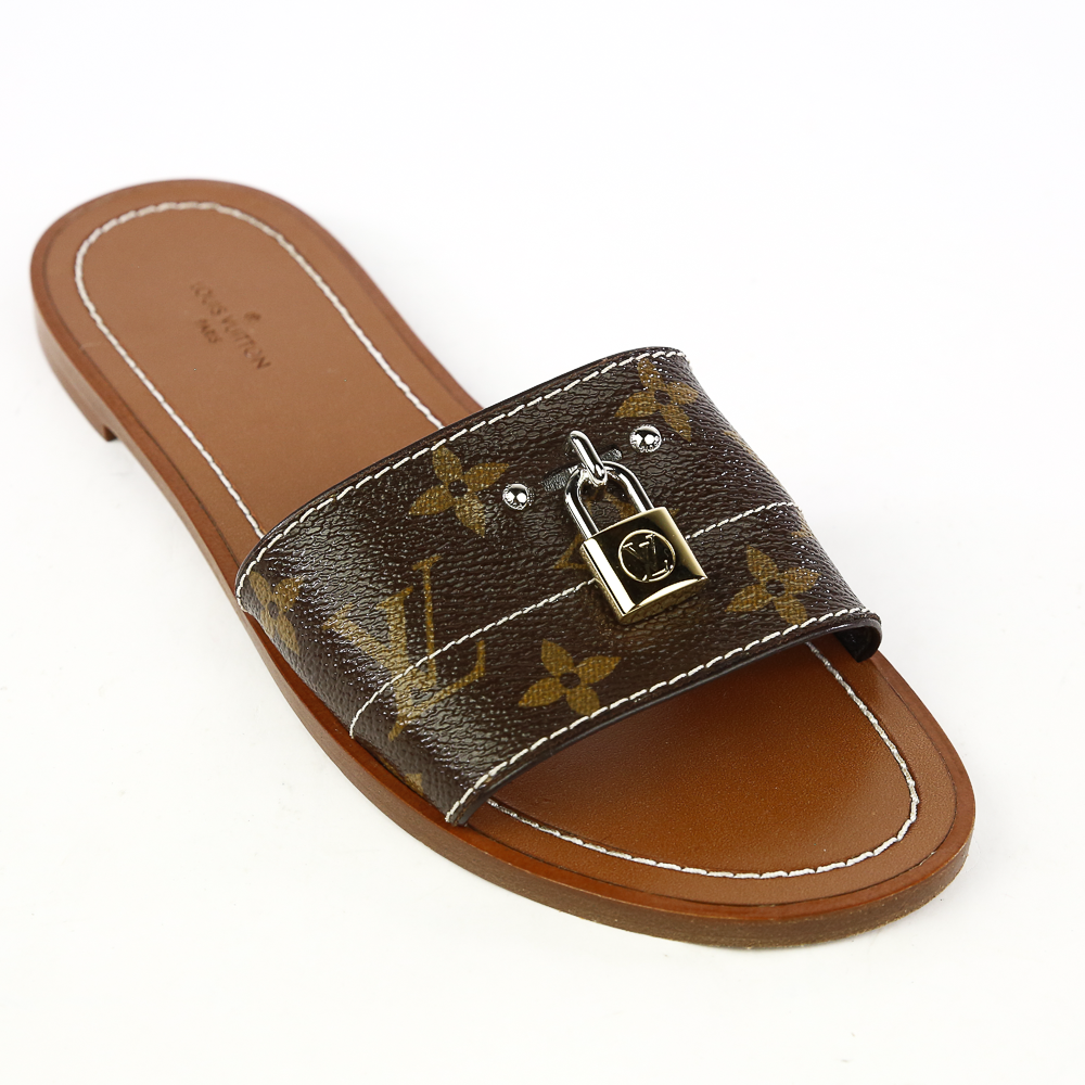 Side view of Louis Vuitton Lock It Monogram Canvas Slides