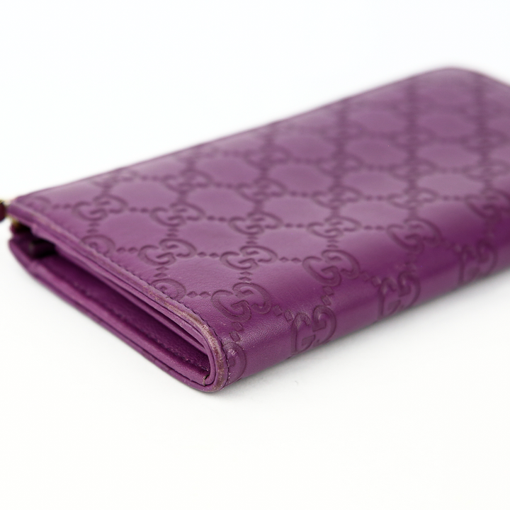 corner view of Gucci Purple Guccissima Leather Bree Wallet
