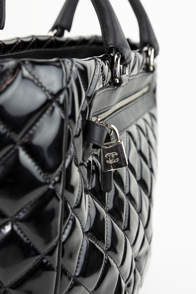 Lock view of Chanel Black Quilted Patent Leather Limited Edition Travel Tote
