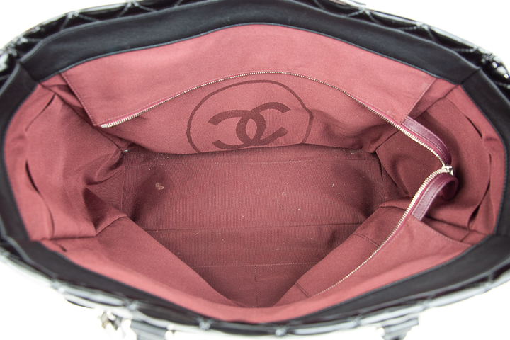 Interior view of Chanel Black Quilted Patent Leather Limited Edition Travel Tote