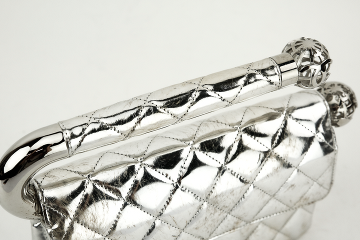Top view of Chanel Around The World Silver Quilted Clutch