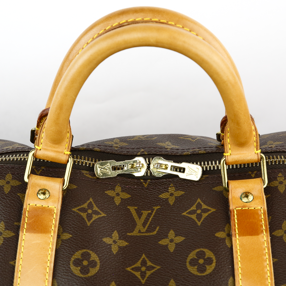 Handle view of Louis Vuitton Monogram Coated Canvas Keepall 60
