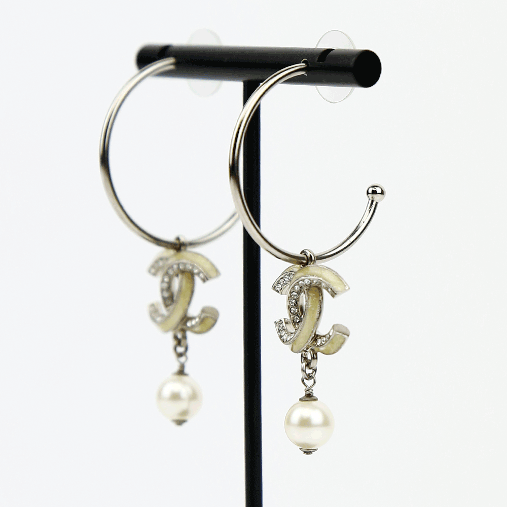 side view of Chanel Silver & Enamel CC Hoop Earrings