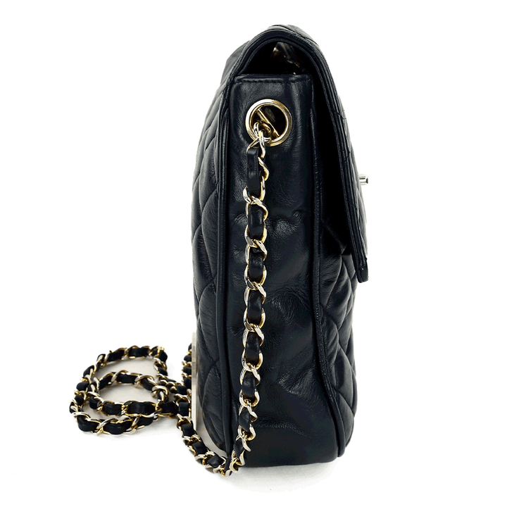 side view of Chanel Vintage Navy Quilted Lambskin Crossbody Bag