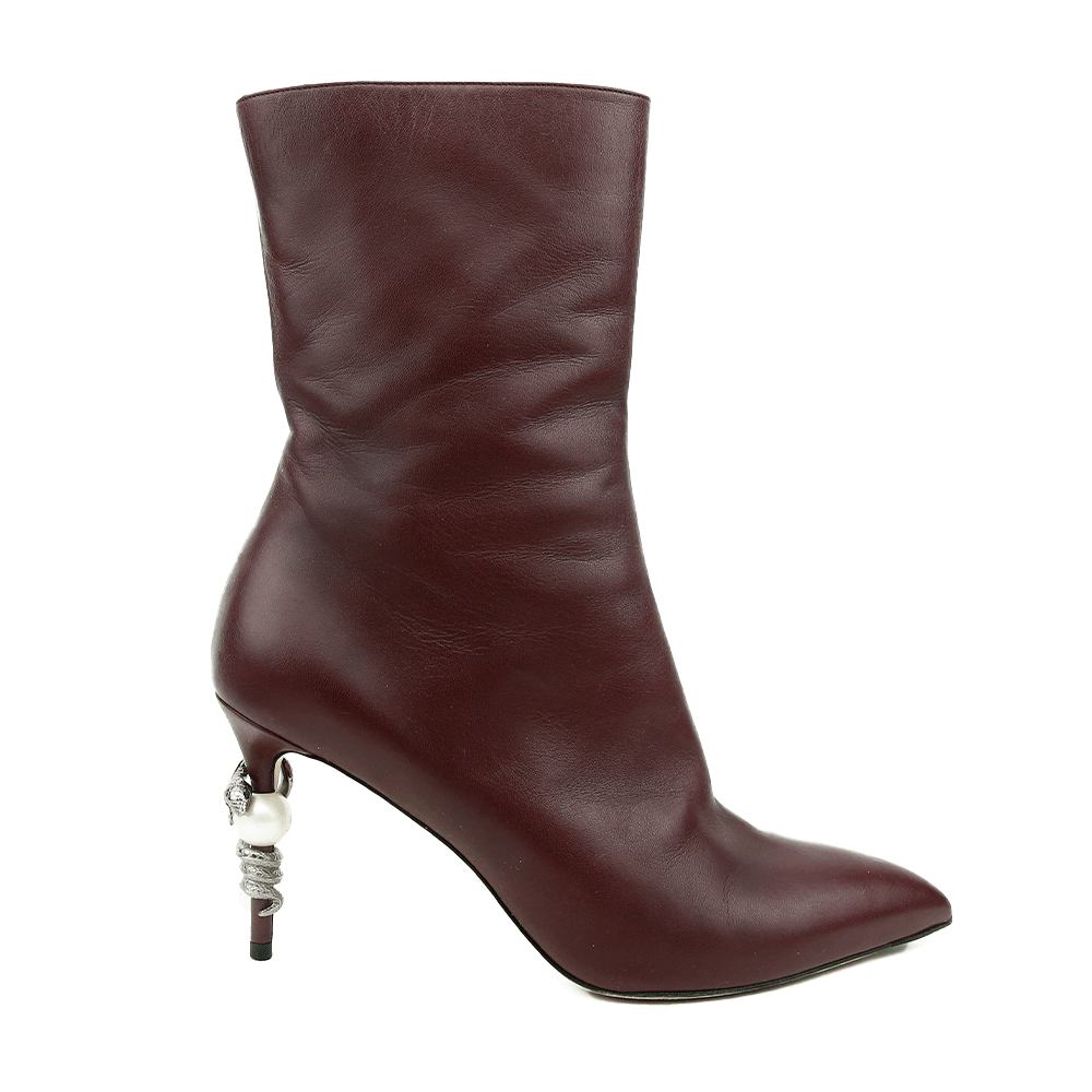 side view of Chanel Burgundy Leather Runway Pearl Boots