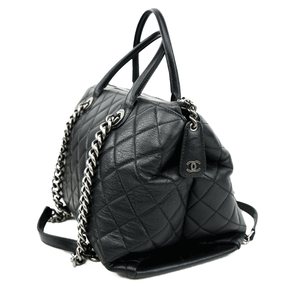 side view of Chanel Boy Chained Medium Black Quilted Tote Bag