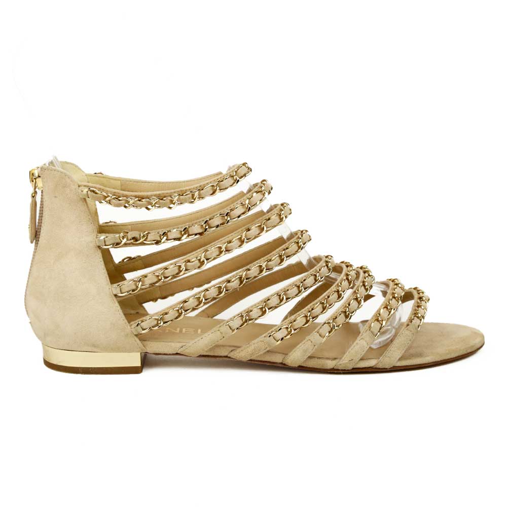 side view of Chanel Beige Kid Suede CC Chain Gladiator Sandals