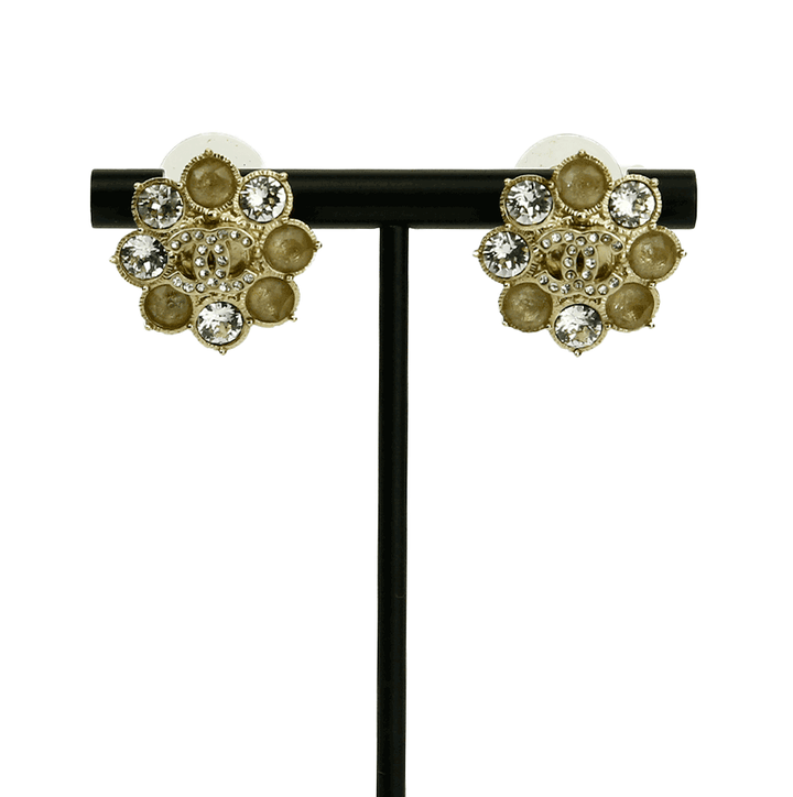 Front view of Chanel Gold Tone & Crystal CC Flower Earrings