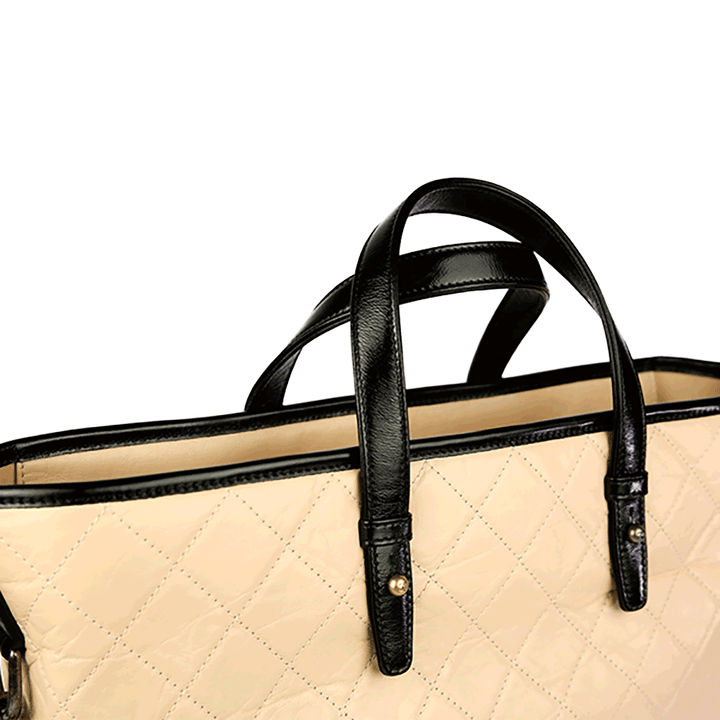 Handle view of Chanel Nude Aged Calfskin Quilted Leather Large Gabrielle Tote