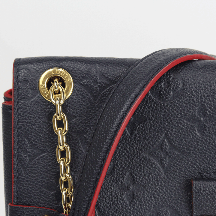 Side View of Louis Vuitton Navy Empreinte Vavin PM Handbag