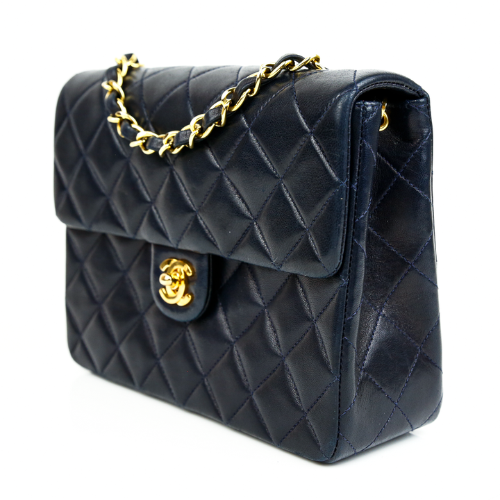 side view of Chanel Navy Vintage Mini Square Classic Flap Bag